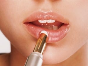 woman-applying-lip-balm