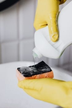 Puring detergent from bottle to sponge