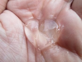 A picture of a gel holding its shape and position after being dispensed into the hand.