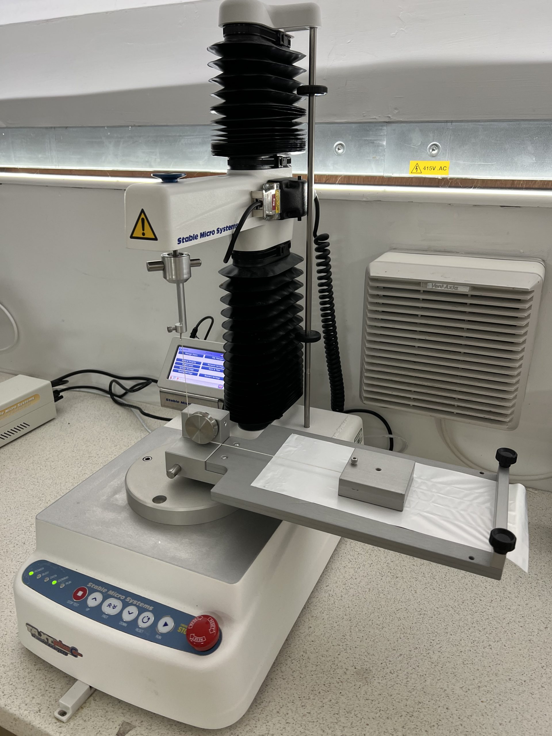 Friction testing service - a picture of a texture analyser with a sled-plane set up.